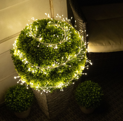 Fairy Lights Wrapped Around A Faux Topiary Wedding Decorating