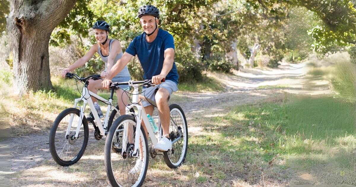 a man and women cycling